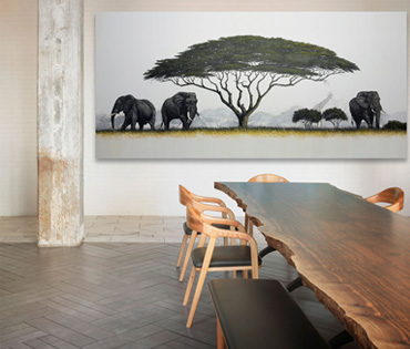 A Nicky van Rensburg painting of three elephants under an umbrella thorn tree
